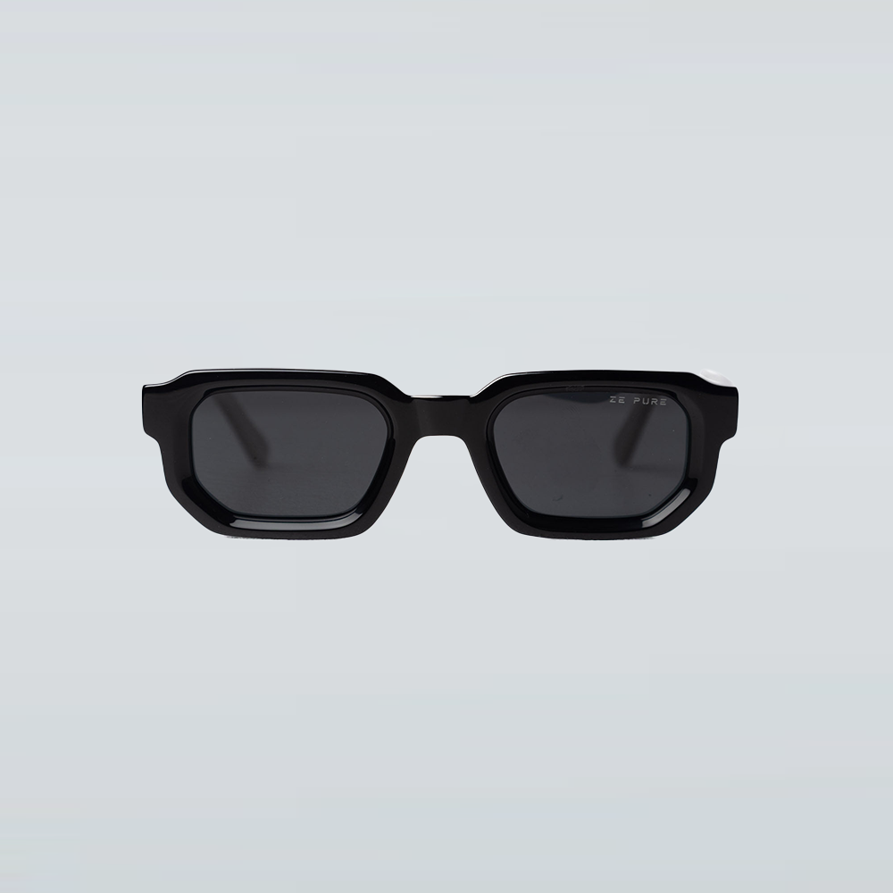 Black sunglasses with dark lenses on a light gray background